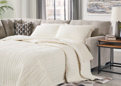 Family Deals Furniture - Ashley Furniture - Mahoney Sectional - 2-Piece Sleeper Sectional with Chaise / Chocolate - 31005S4