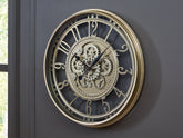 Family Deals Furniture - Ashley Furniture - Gilover Wall Decor - Wall Clock / Champagne Finish - A8010386