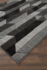Family Deals Furniture - Ashley Furniture - Chayse Rug - 6'6" x 9'6" Rug / Black/Gray - R403461