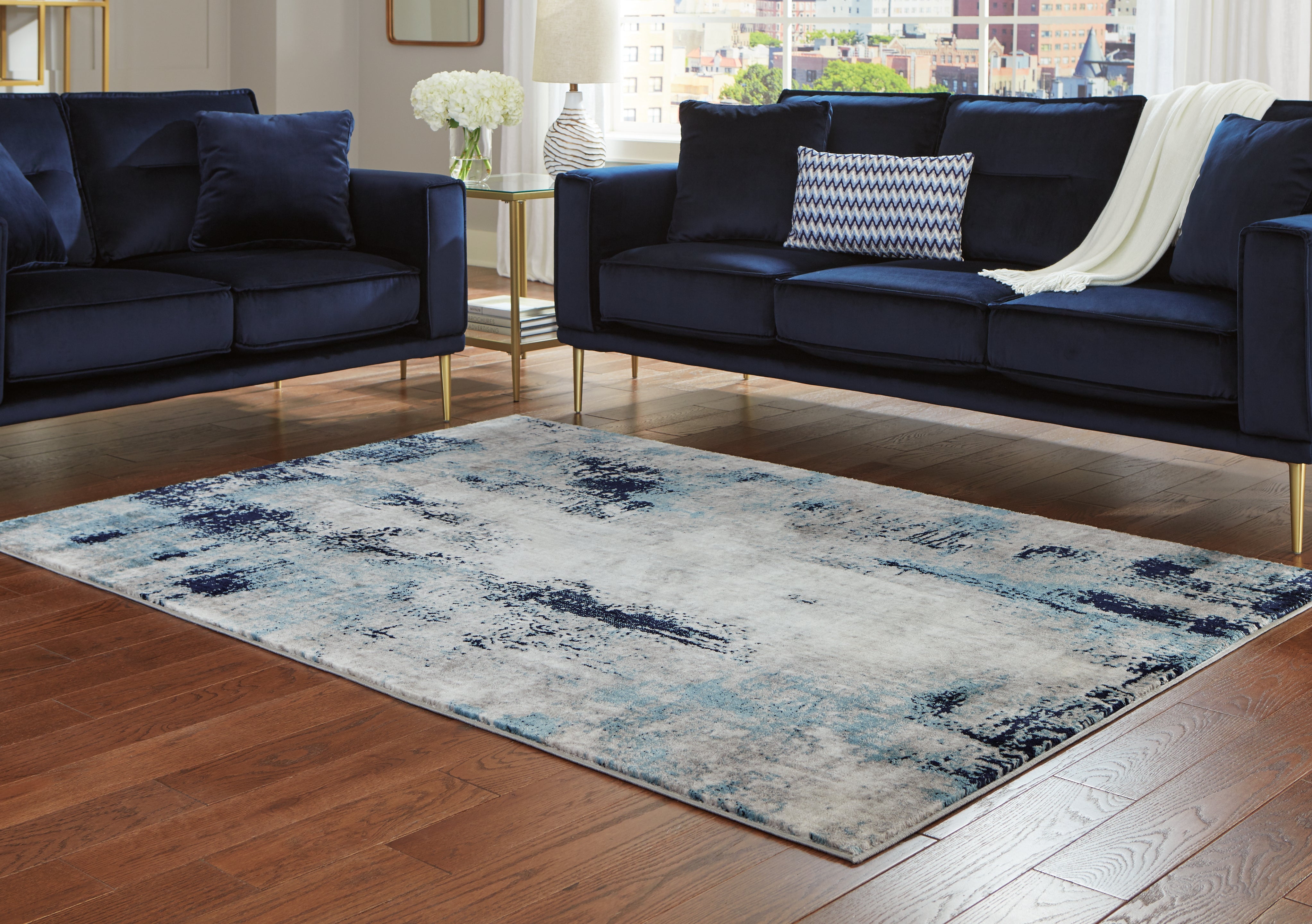 Family Deals Furniture - Ashley Furniture - Leonelle Rug - 7'10" x 10' Rug / White/Blue/Gray - R404871