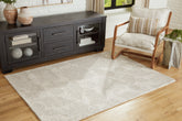 Family Deals Furniture - Ashley Furniture - Chadess Rug - 5' x 7' Rug / Linen/Taupe - R406362