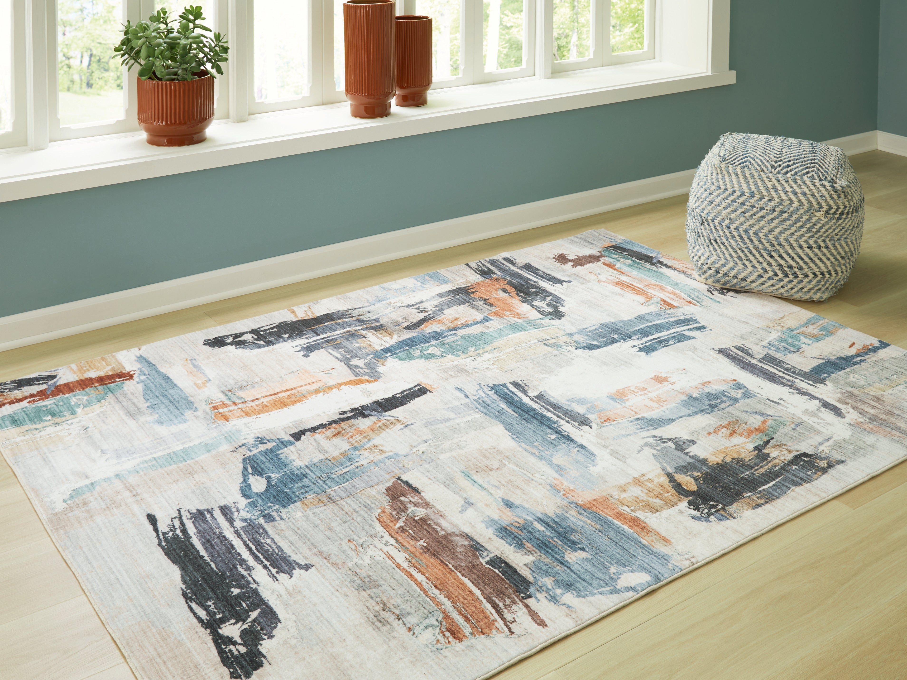 Family Deals Furniture - Ashley Furniture - Hessland Rug - 5' x 7' Washable Rug / Multi - R407052
