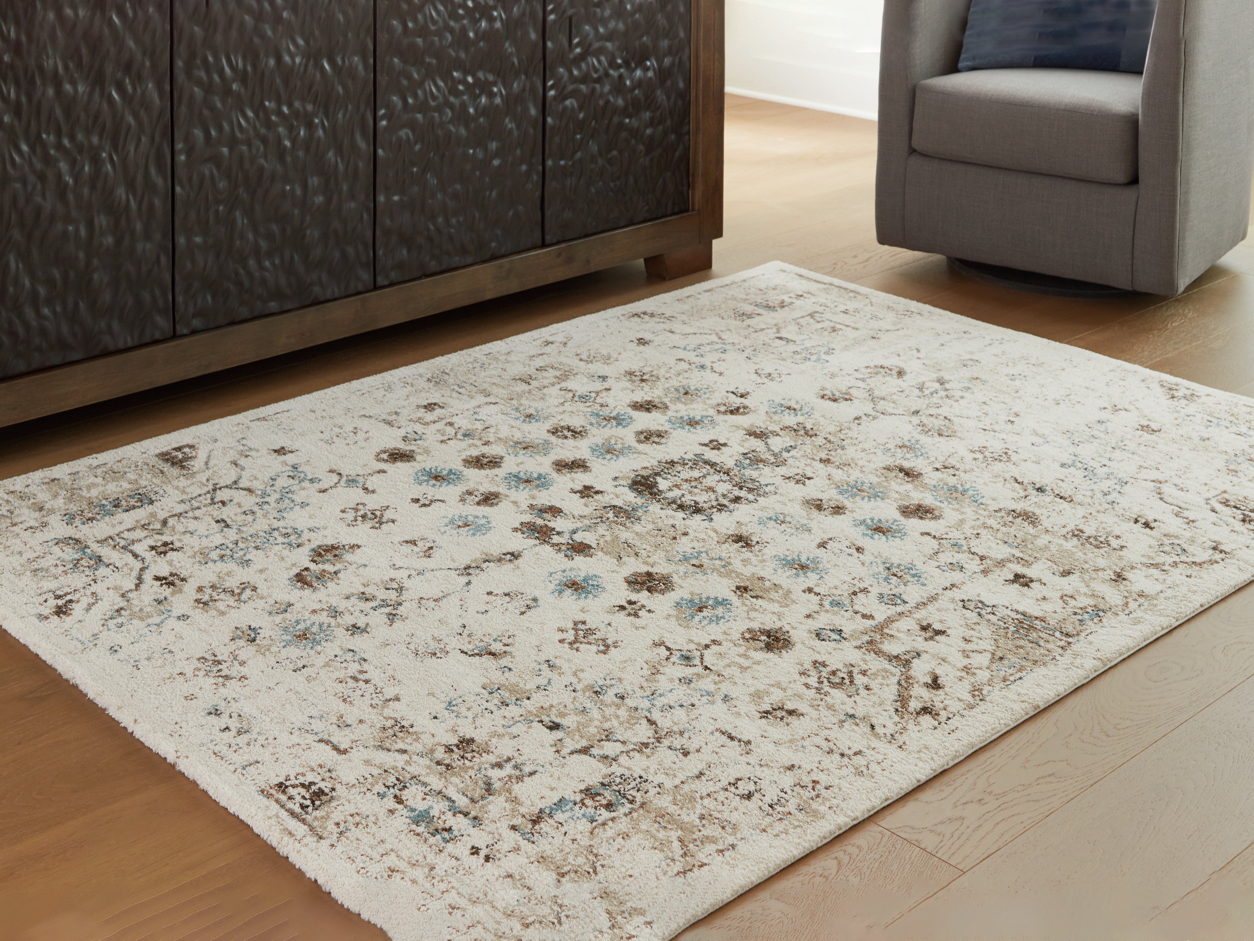Family Deals Furniture - Ashley Furniture - Jossler Rug - 5' x 7' Rug / Ivory/Brown/Teal - R407072