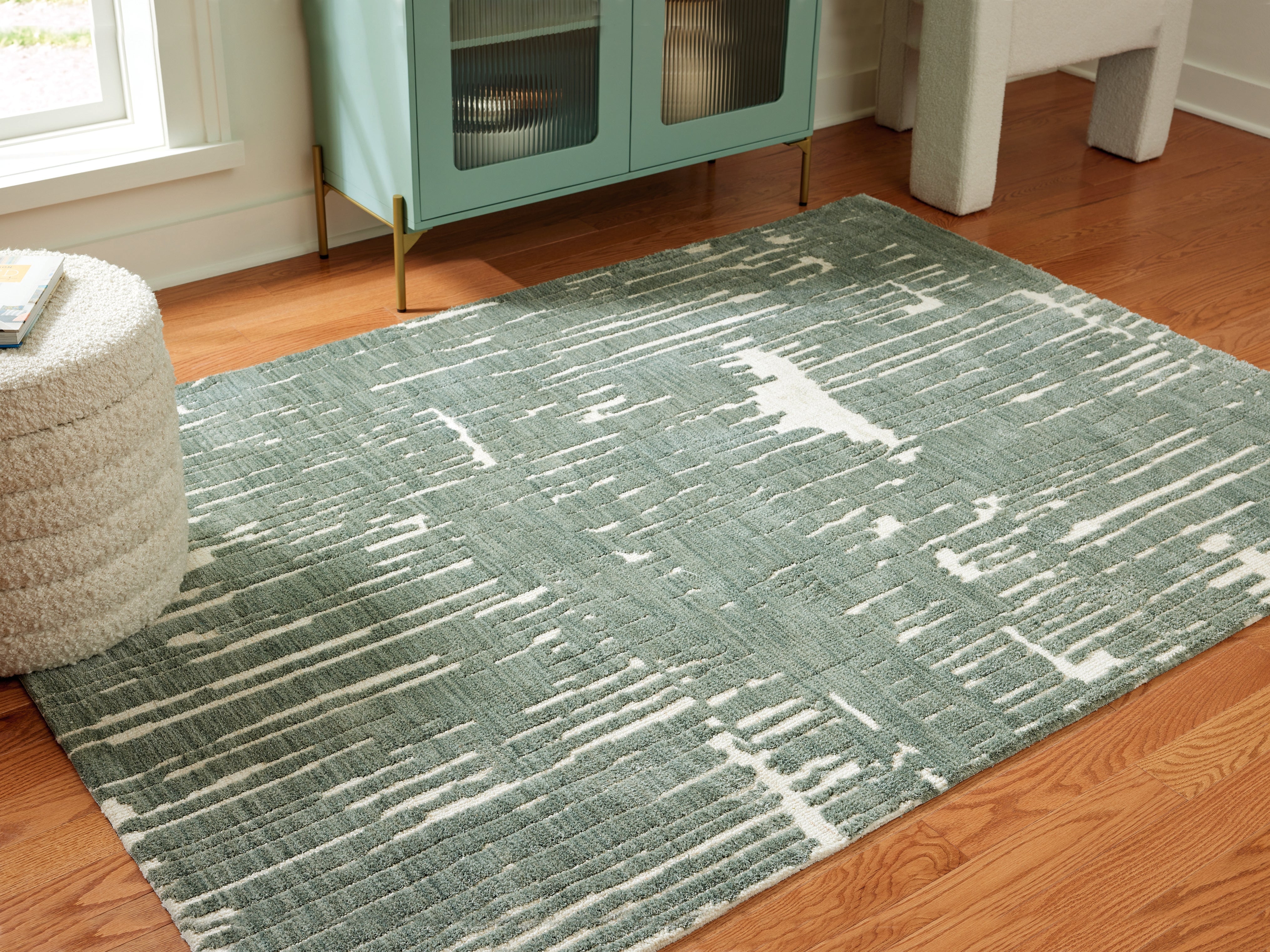 Family Deals Furniture - Ashley Furniture - Cayworth Rug - 5' x 7' Rug / Teal/White - R407092