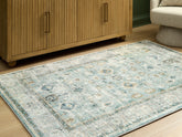 Family Deals Furniture - Ashley Furniture - Ladstoney Rug - 7'6" x 9'6" Area Rug / Teal/Beige/Ochre - R407501
