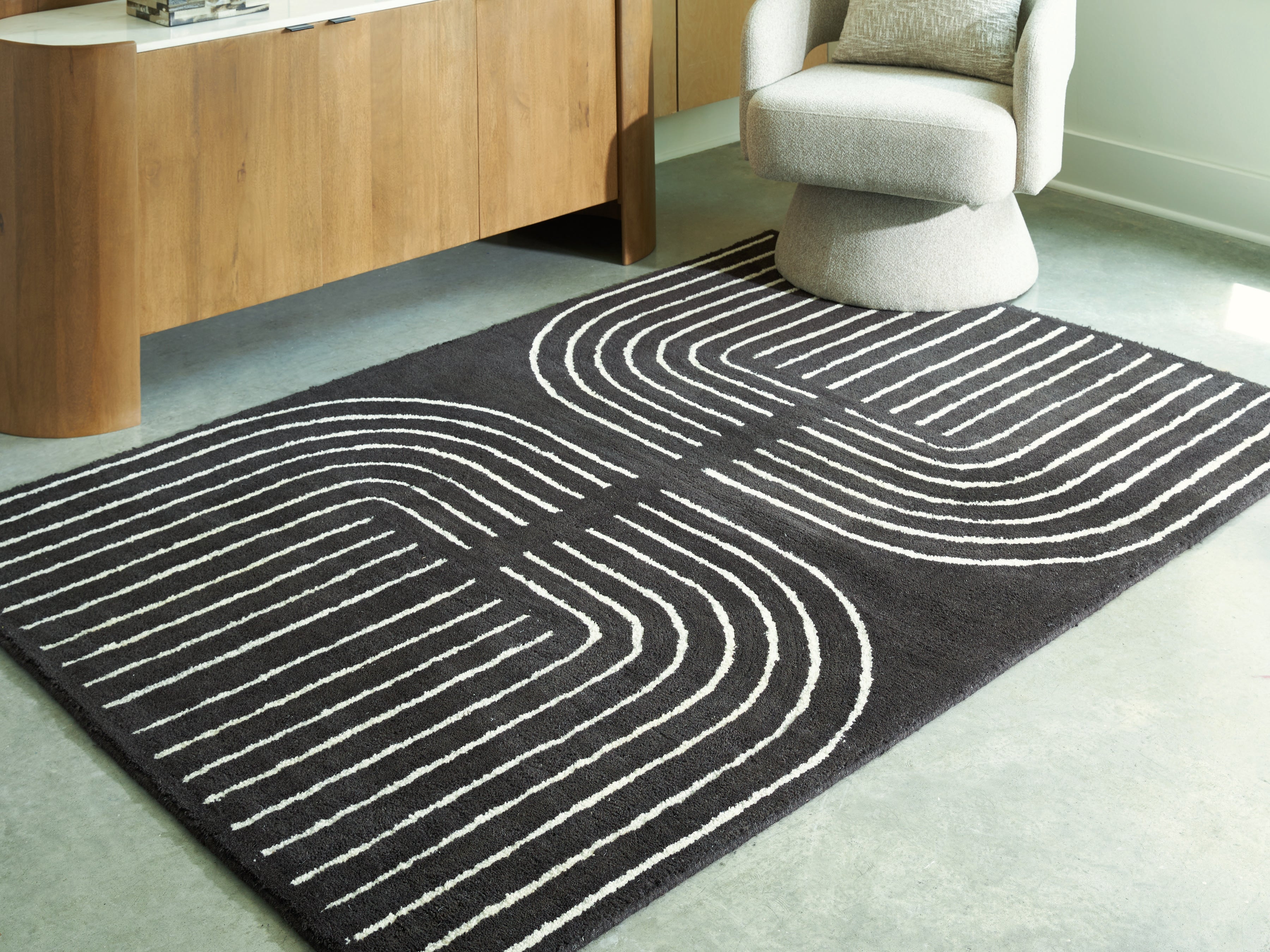 Family Deals Furniture - Ashley Furniture - Eldonmore Rug - 5' x 7' Area Rug / Black/Ivory - R407572