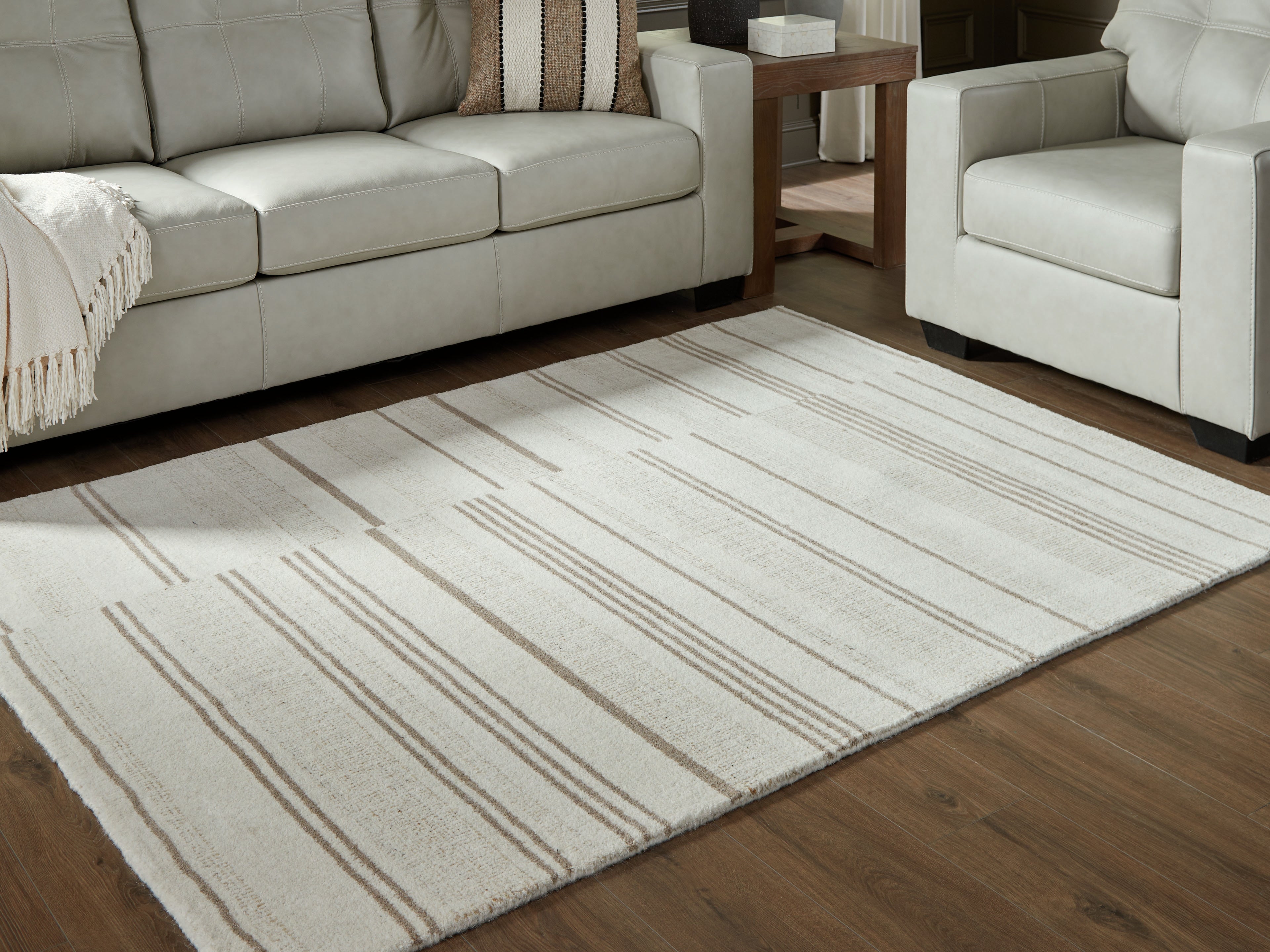 Family Deals Furniture - Ashley Furniture - Gadence Rug - 7'8" x 10' Area Rug / Ivory/Tan - R407641