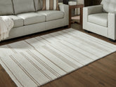 Family Deals Furniture - Ashley Furniture - Gadence Rug - 7'8" x 10' Area Rug / Ivory/Tan - R407641