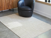 Family Deals Furniture - Ashley Furniture - Wolbert Rug - 5' x 7' Area Rug / Tan/Ivory - R407662
