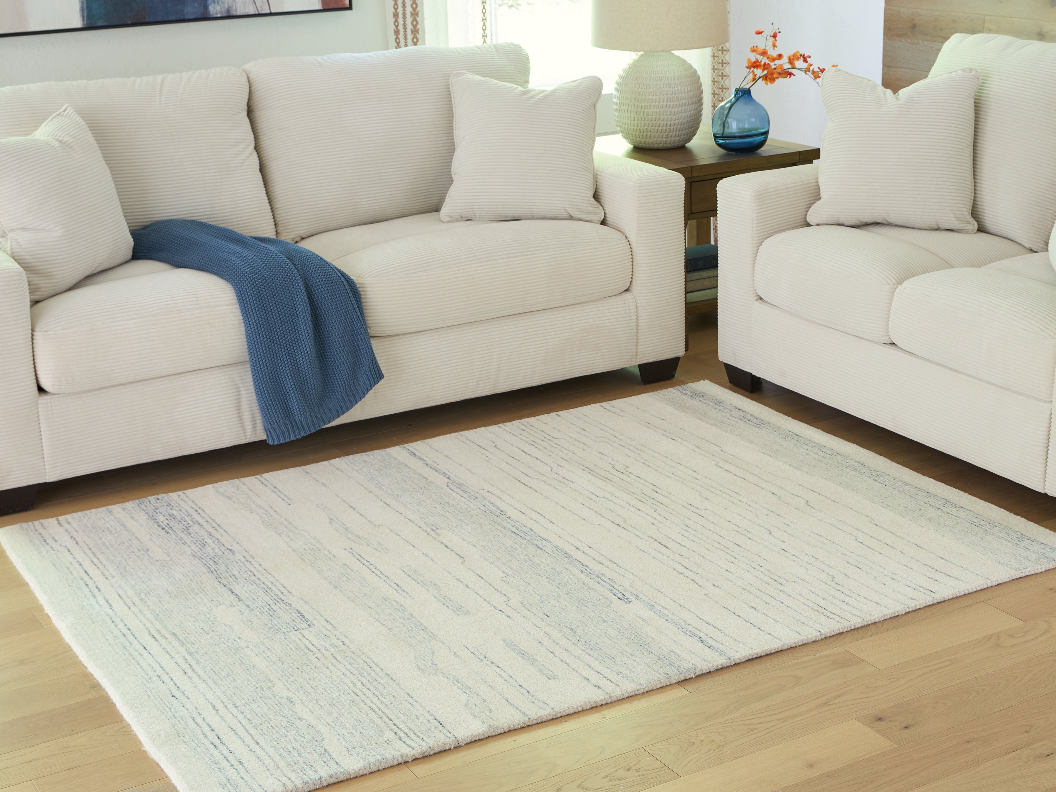 Family Deals Furniture - Ashley Furniture - Genemost Rug - 5' x 7' Area Rug / Ivory/Blue - R407842