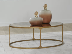 Family Deals Furniture - Ashley Furniture - Korajane Coffee Table - Oval Cocktail Table / Antique Gold - T399-0