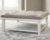 Family Deals Furniture - Ashley Furniture - Kanwyn Upholstered Ottoman Coffee Table - UPH Ottoman Cocktail Table / Whitewash - T937-21