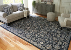 Family Deals Furniture - Ashley Furniture - Hilcott Rug - 7'10" x 10'6" Rug / Blue/Cream/Brown - R406111