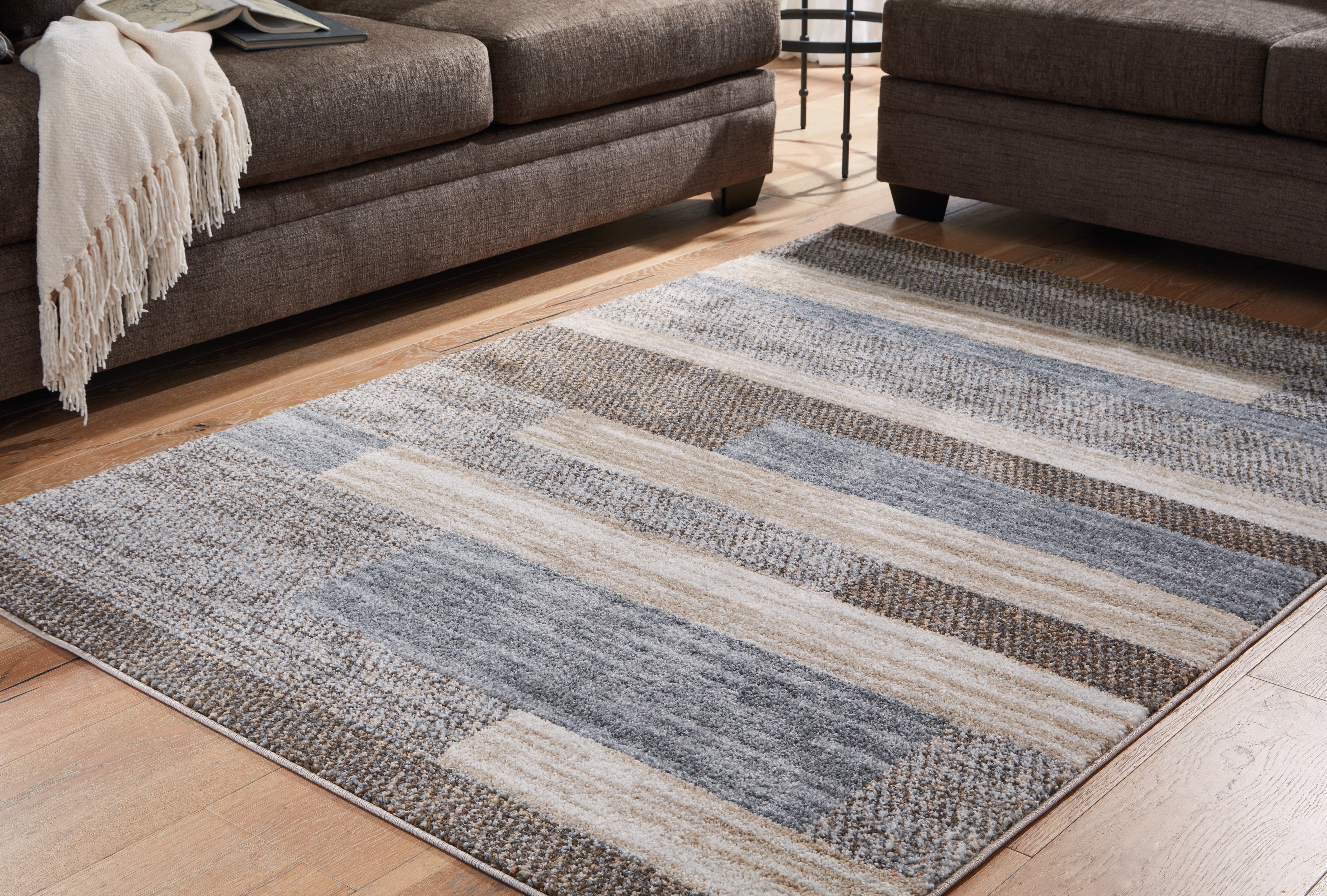 Family Deals Furniture - Ashley Furniture - Sethburn Rug - 5' x 7' Rug / Cream/Brown/Gray - R406592