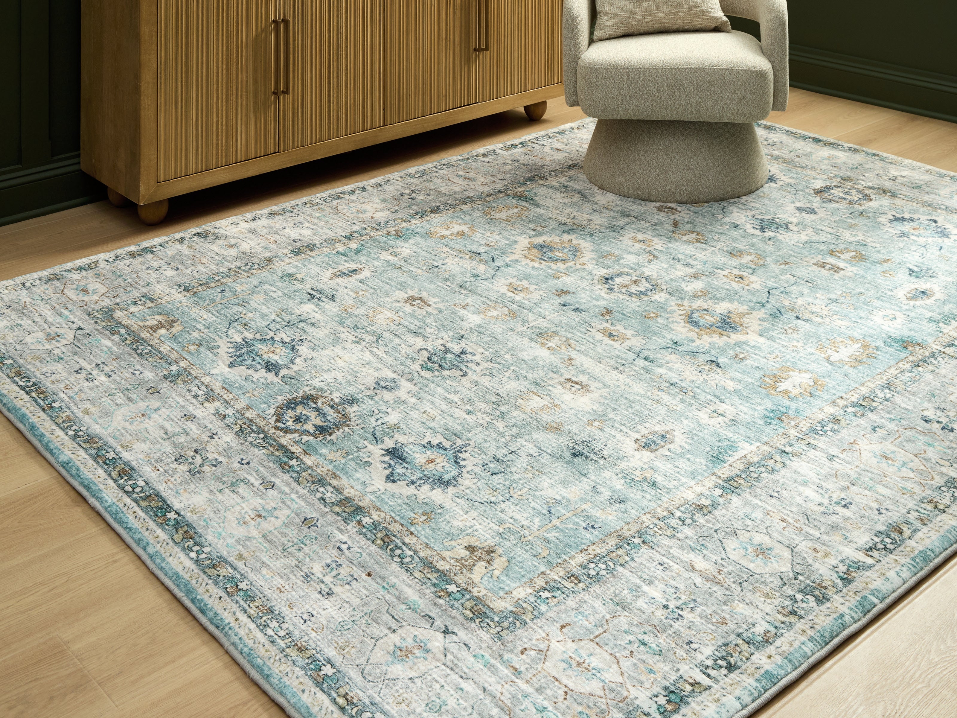 Family Deals Furniture - Ashley Furniture - Ladstoney Rug - 7'6" x 9'6" Area Rug / Teal/Beige/Ochre - R407501