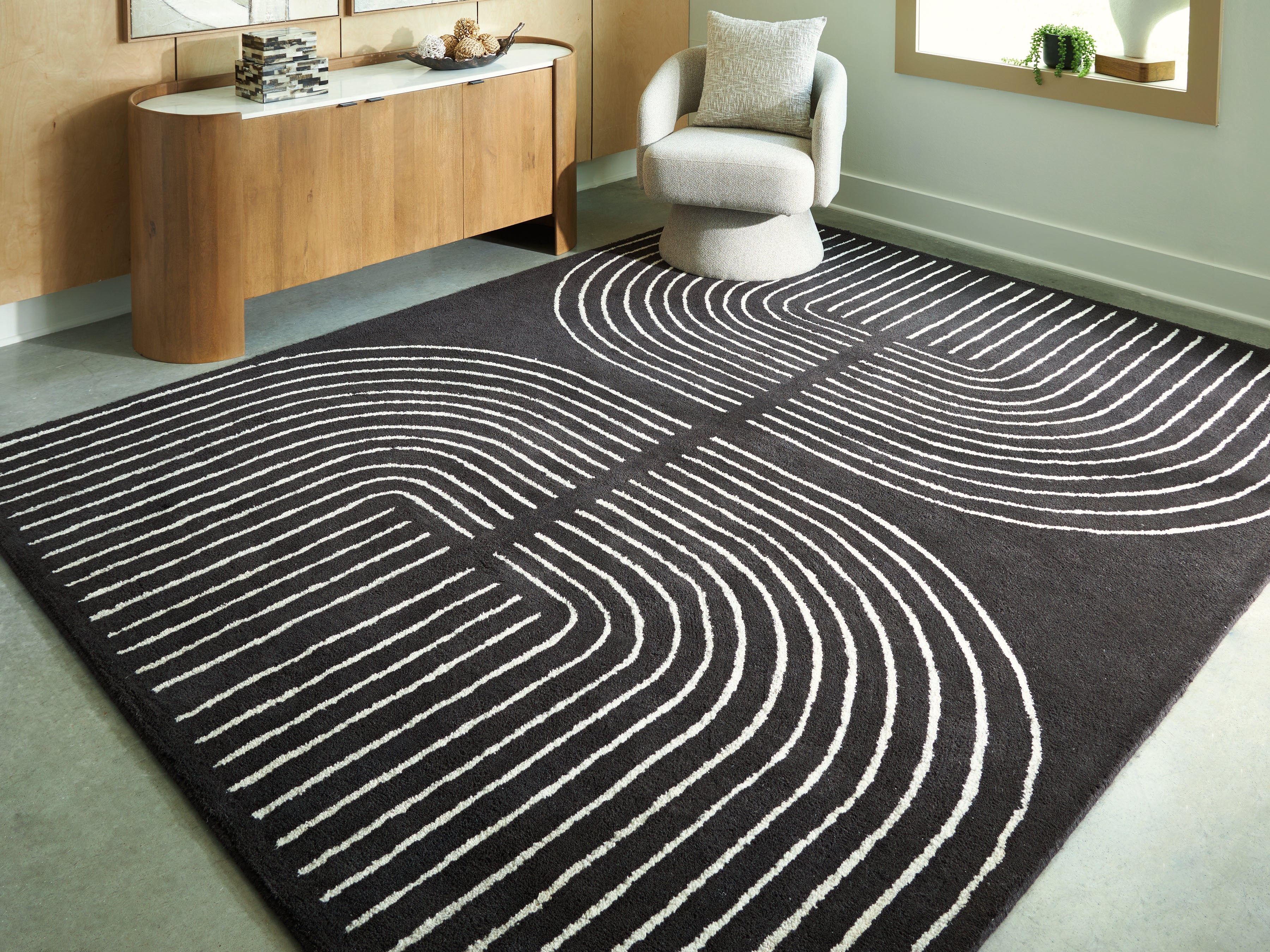 Family Deals Furniture - Ashley Furniture - Eldonmore Rug - 7'8" x 10' Area Rug / Black/Ivory - R407571