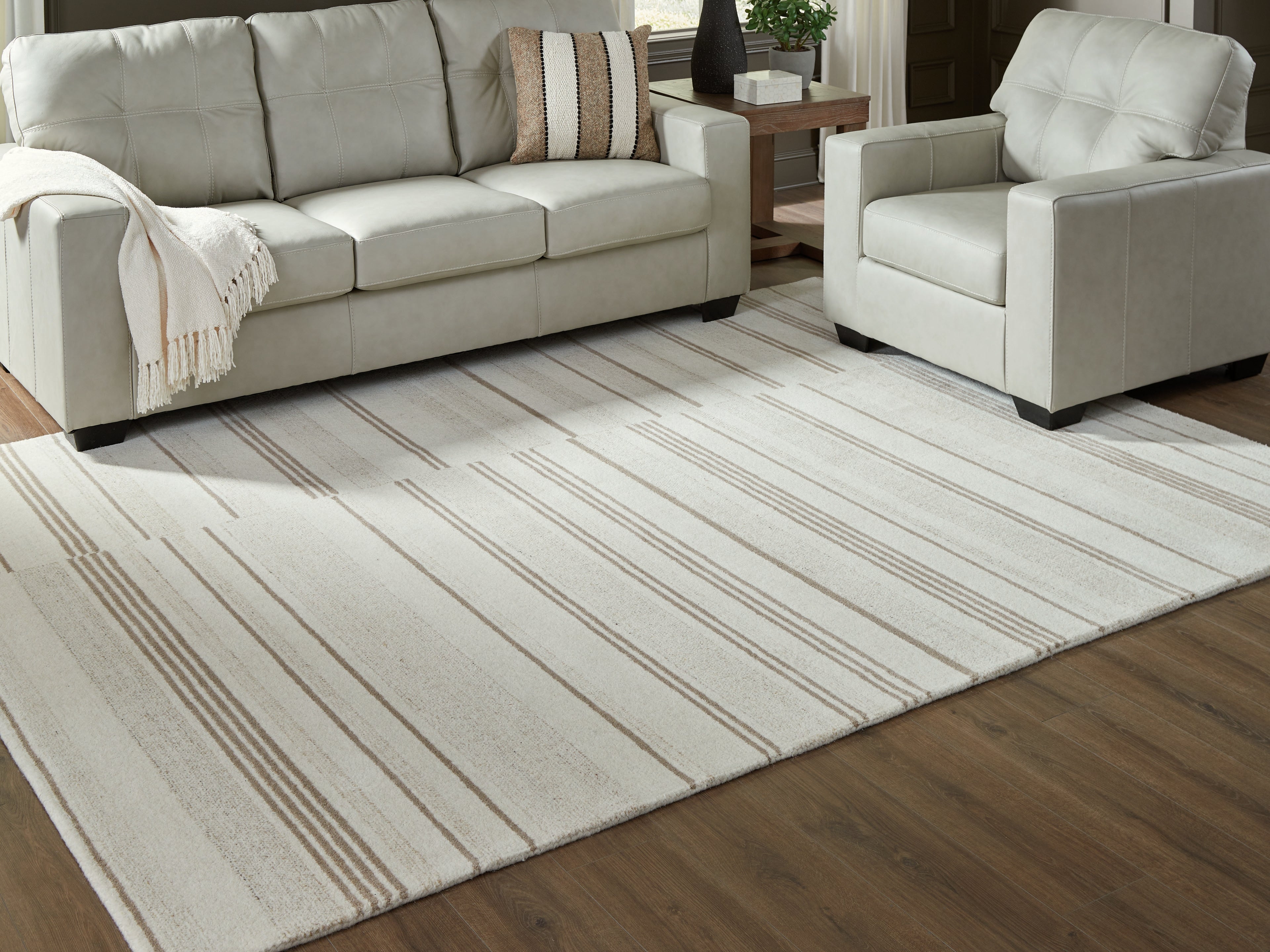 Family Deals Furniture - Ashley Furniture - Gadence Rug - 7'8" x 10' Area Rug / Ivory/Tan - R407641