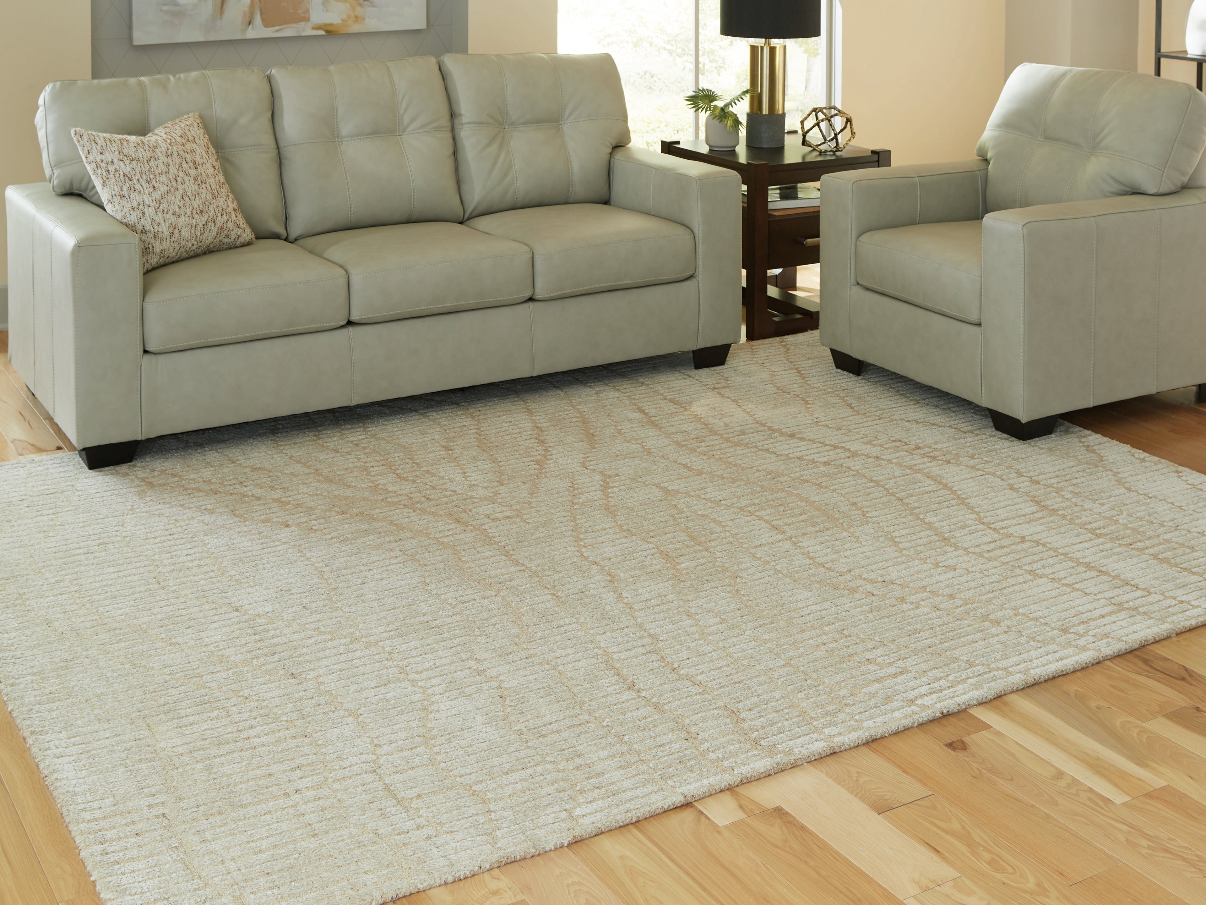 Family Deals Furniture - Ashley Furniture - Jaseena Rug - 7'8" x 10' Area Rug / Beige/Tan - R407721